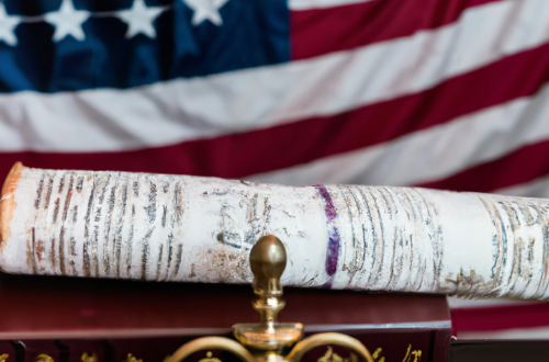 Torah with American flag in background - Judeo-Christian tradition